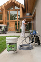Load image into Gallery viewer, Spray painting DuraSoy One on an exterior residential home